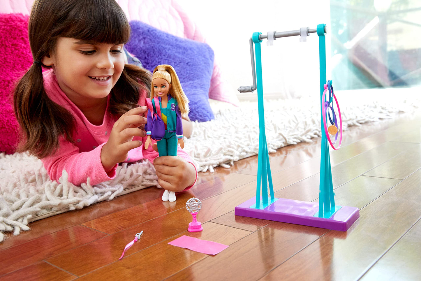 Barbie Team Stacie Doll and Gymnastics Playset with Spinning Bar and 7 Themed Accessories for 3 to 7 Year Olds